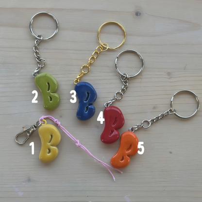 Porte-clés initiale de couleur
